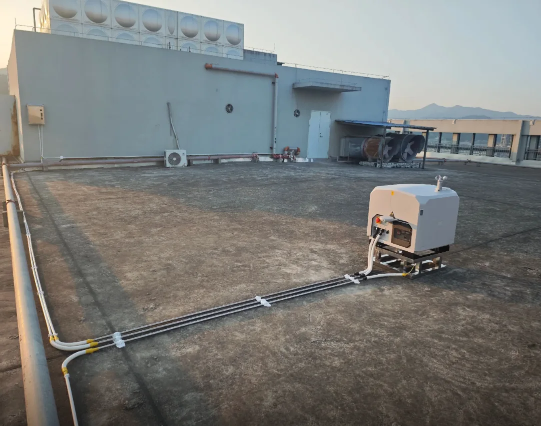 Permanent cable routing leading to DJI Dock 3 across an industrial rooftop